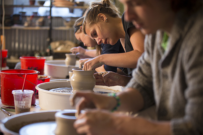 Students working on ceramics in the ceramics studio