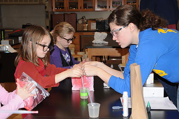 A Juniata Education major teaches young students during Summer Chemistry Camp