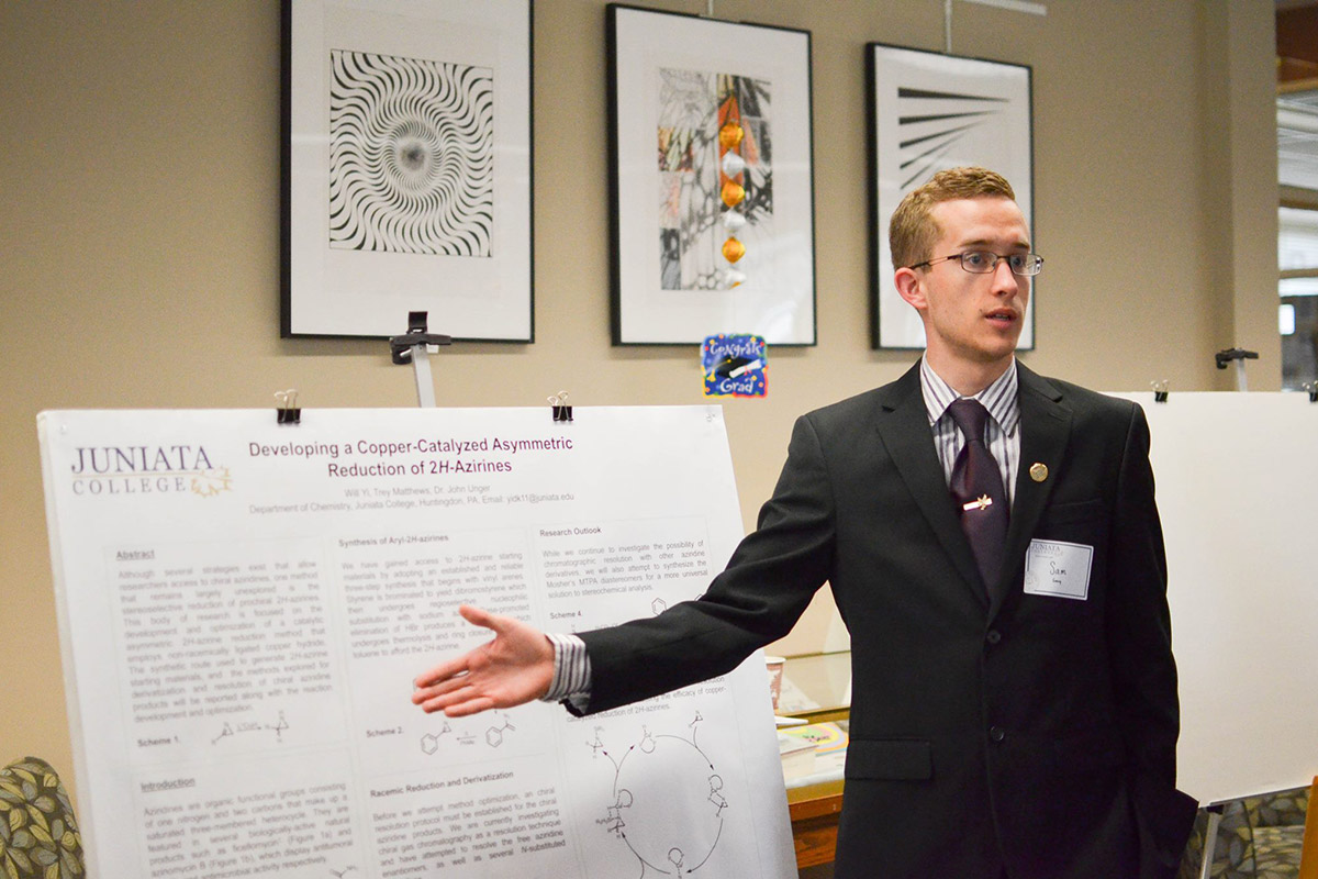 Sam Presenting at The Liberal Arts Symposium. Liberal Arts Symposium (LAS) is a campus-wide research conference at which students present their capstone projects, displaying their deep knowledge of many subjects.